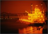 Mississippi River steamboat at night
